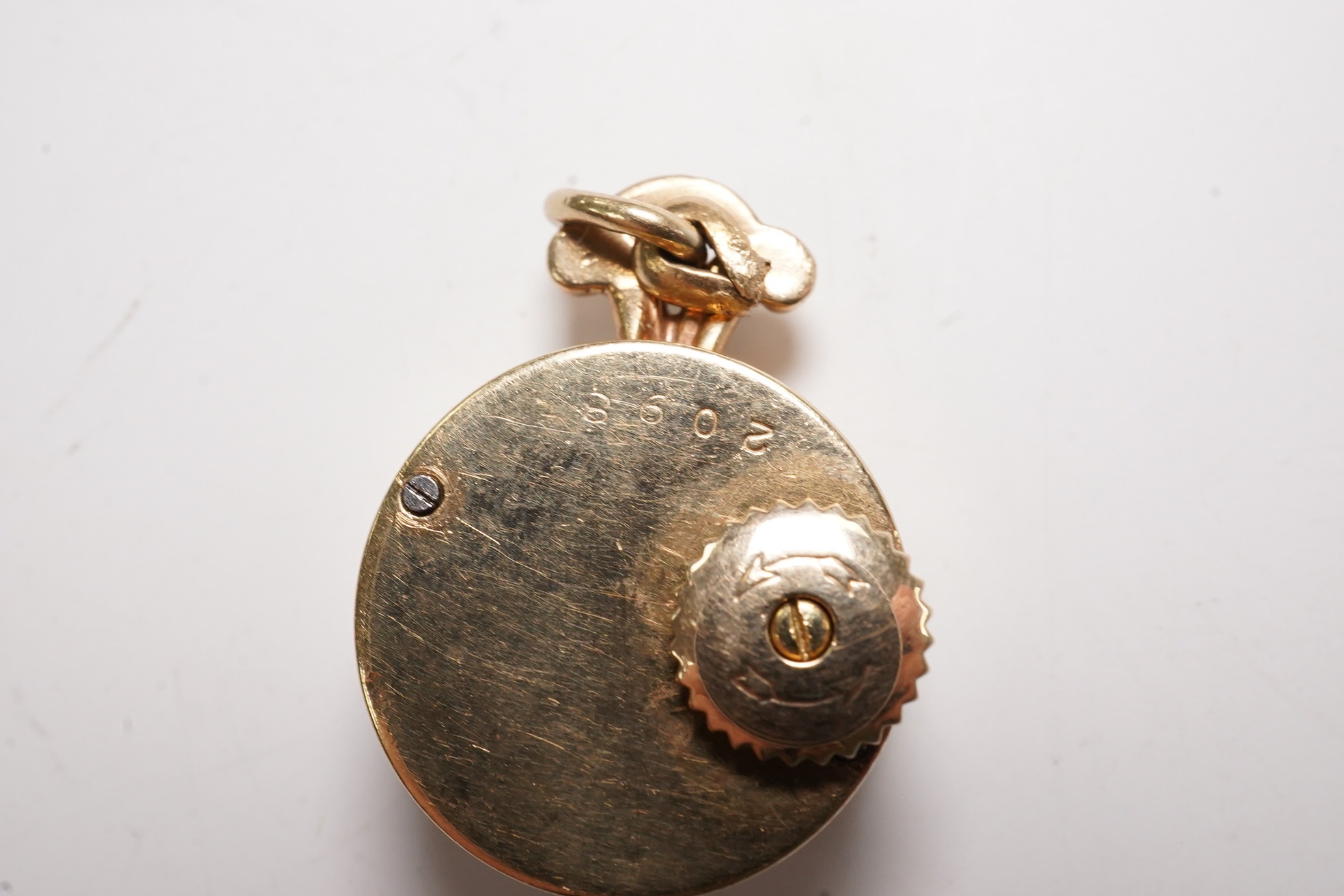 A lady's 9ct Jaeger LeCoultre manual back wind pendant watch, case diameter 15mm, gross weight 7.1 grams. Condition - fair